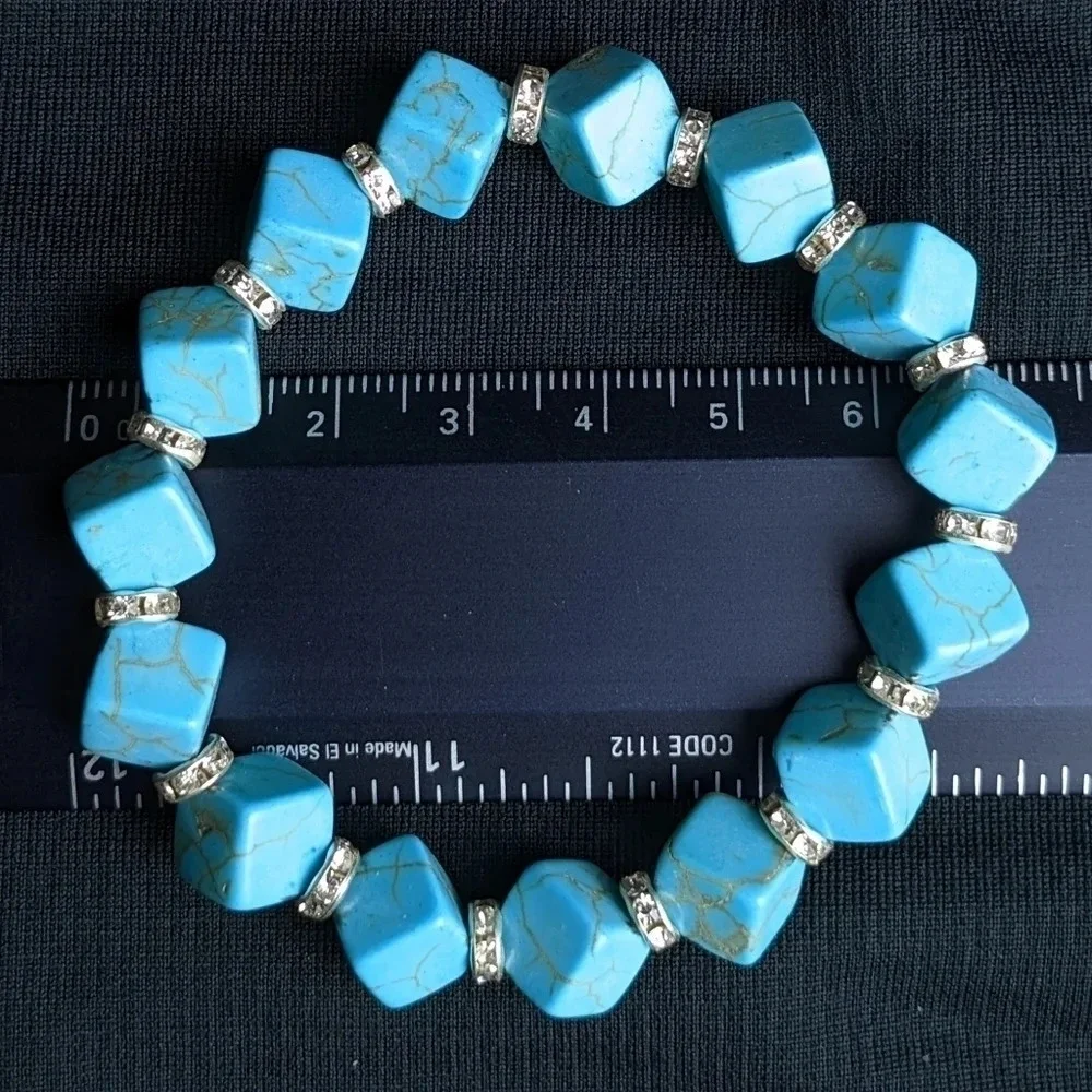 Pretty faux turquoise color beaded bracelet with CZ accents, cube shape beads
